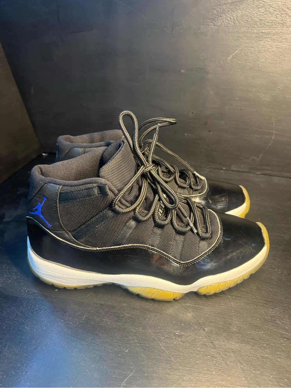 Jordan 11 Men’s Black Sneakers with Blue Jumpman